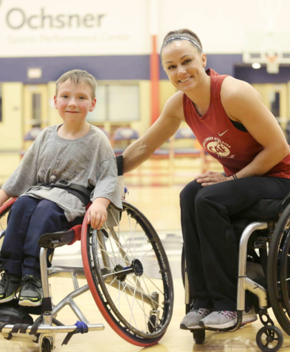 boy and woman athletes in wheelchair