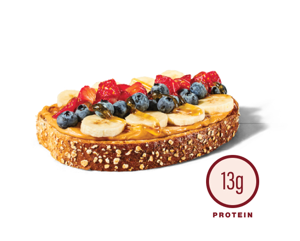Loaded peanut butter toast topped with fruit and honey - 13g protein