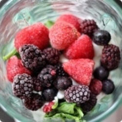 top of blender with fruit
