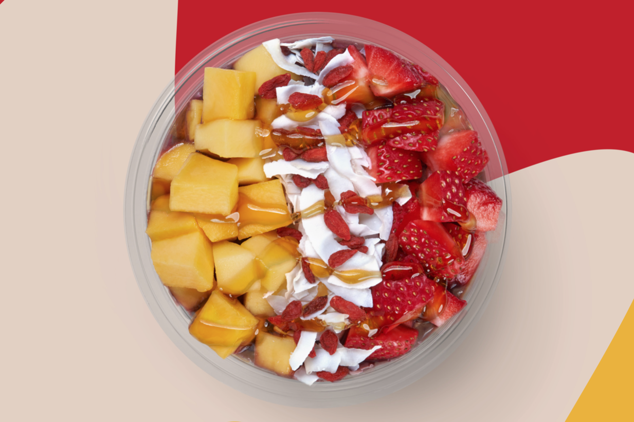 Berry Goji Getaway acai breakfast bowl from Smoothie King topped with fresh fruit, coconut, and honey
